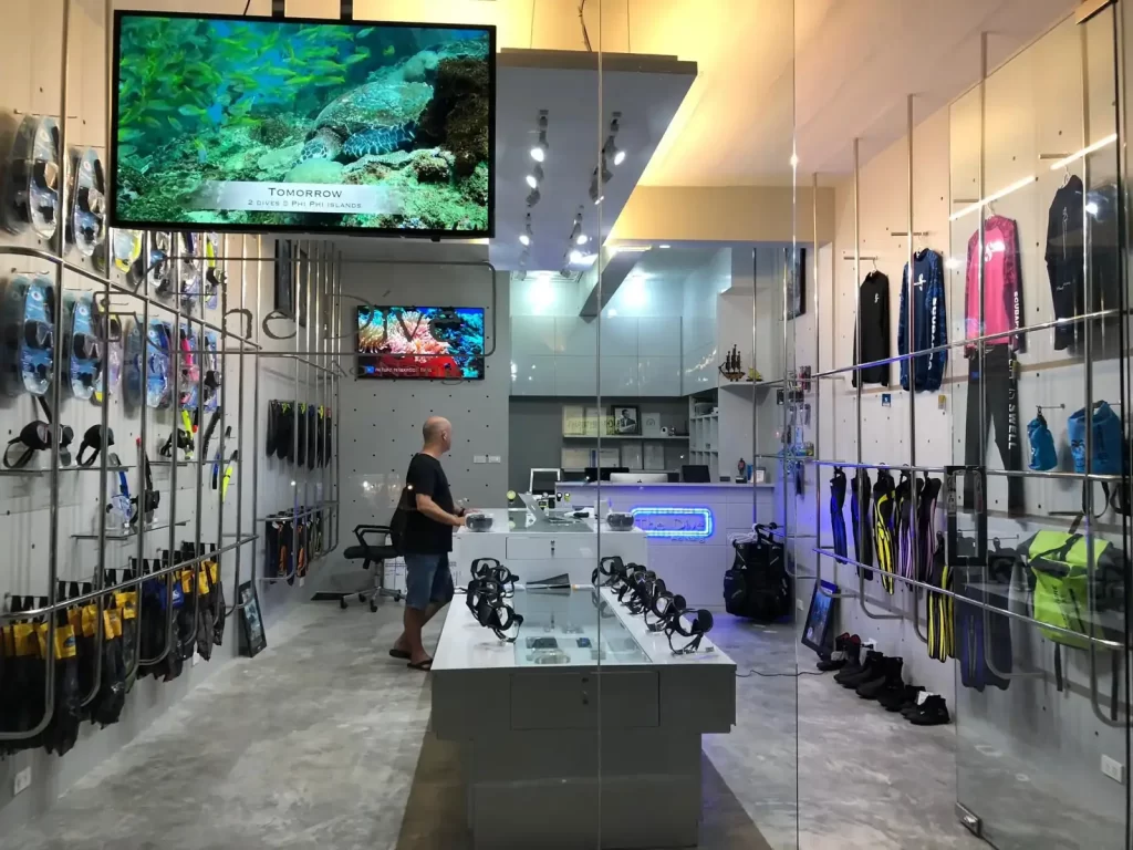 Inside the The Dive scuba diving shop in Ao Nang displaying course information and equiment for sale.